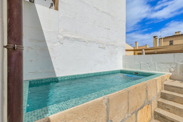 High-quality renovated apartment with historic character and pool image 9